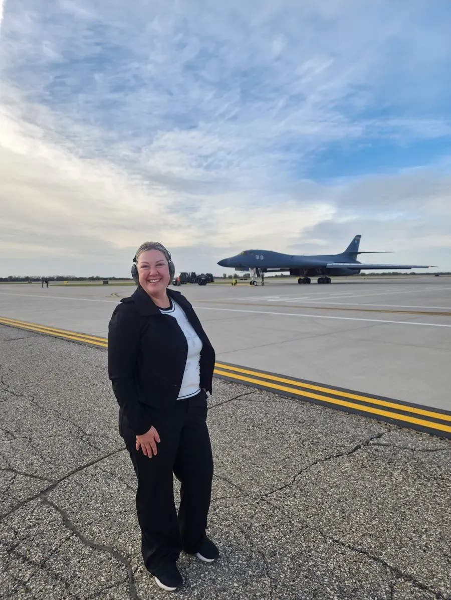 Lea Greene on the flightline in front of a B-1B bomber
